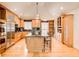 Bright, spacious kitchen featuring a large island, stainless steel appliances, and custom cabinetry at 3845 Parian Nw Rdg, Atlanta, GA 30327