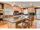 Well-appointed kitchen featuring a large island with seating, stainless steel appliances, and granite countertops at 3845 Parian Nw Rdg, Atlanta, GA 30327