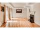 Spacious living room with hardwood floors, a fireplace, and natural light, ideal for relaxation at 3845 Parian Nw Rdg, Atlanta, GA 30327
