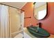 Stylish bathroom featuring a shower/tub combo and modern sink with black hardware at 589 Fox Creek Xing, Woodstock, GA 30188