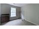 Bedroom with carpet and plenty of light offers a calm space for relaxation and rest at 589 Fox Creek Xing, Woodstock, GA 30188