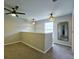 Hallway area with carpet, ceiling fan, and natural light makes an inviting area for the home at 589 Fox Creek Xing, Woodstock, GA 30188