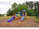 Community playground with colorful slides and climbing structures for children at 589 Fox Creek Xing, Woodstock, GA 30188