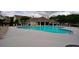Community pool with lounge chairs and tables for residents to enjoy at 589 Fox Creek Xing, Woodstock, GA 30188
