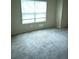 Bedroom with neutral walls, carpet flooring and natural light from the window at 107 Highwood Ln, Atlanta, GA 30344