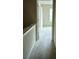 Hallway with carpet flooring leading to a bedroom with natural light at 107 Highwood Ln, Atlanta, GA 30344