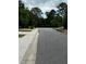 A quiet street lined with trees in a residential neighborhood at 107 Highwood Ln, Atlanta, GA 30344