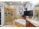 Bathroom features a tiled glass shower, soaking tub, granite counters, and cherry cabinets at 2849 Beddington Way, Suwanee, GA 30024