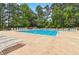 Sparkling community pool with lounge chairs, perfect for relaxation and recreation in a serene setting at 2849 Beddington Way, Suwanee, GA 30024