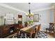 Charming dining room with hardwood floors, elegant chandelier, and stylish decor at 2849 Beddington Way, Suwanee, GA 30024