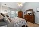 Tranquil main bedroom with a bay window, a ceiling fan and wooden furniture at 2849 Beddington Way, Suwanee, GA 30024