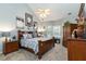Main bedroom suite with vaulted ceilings, a ceiling fan, and plenty of natural light from bay windows at 2849 Beddington Way, Suwanee, GA 30024
