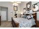 Charming main bedroom featuring neutral paint, ceiling fan, and multiple framed art pieces at 2849 Beddington Way, Suwanee, GA 30024