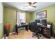 Dedicated home office featuring a large desk, comfortable chair, and a window to provide natural light at 2849 Beddington Way, Suwanee, GA 30024