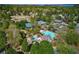 Aerial view of community with pool, tennis courts, playground, and lake views at 3265 Bentwood Close, Cumming, GA 30041