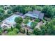 Aerial view of the clubhouse, swimming pool, lounge areas, and landscaped grounds at 3265 Bentwood Close, Cumming, GA 30041