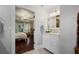 En-suite bathroom with vanity and soaking tub, and view into main bedroom at 3265 Bentwood Close, Cumming, GA 30041