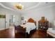 Comfortable bedroom featuring dark wood floors and access to an ensuite bathroom at 3265 Bentwood Close, Cumming, GA 30041