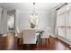 Dining room showcasing hardwood floors, modern lighting, and an elegant setting at 3265 Bentwood Close, Cumming, GA 30041