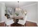 Dining room with hardwood floors and diamond-shaped mirrors at 3265 Bentwood Close, Cumming, GA 30041