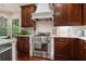 Kitchen with stainless steel range and subway tile backsplash at 3265 Bentwood Close, Cumming, GA 30041