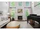 Living room featuring a fireplace, hardwood floors, and lots of natural light at 3265 Bentwood Close, Cumming, GA 30041