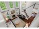 Bright living room boasts large windows, fireplace, hardwood floors, and piano at 3265 Bentwood Close, Cumming, GA 30041