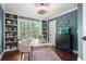 Bright office with built-in shelving, hardwood floors, and a large window at 3265 Bentwood Close, Cumming, GA 30041