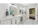 Bright bathroom with double vanity, soaking tub, walk-in shower and checkered floors at 3851 Glenhurst Se Dr, Smyrna, GA 30080