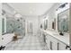Luxurious bathroom featuring a soaking tub, walk-in shower, and double vanity at 3851 Glenhurst Se Dr, Smyrna, GA 30080