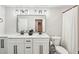 Bright bathroom featuring double vanity, quartz countertop, modern fixtures, tiled shower, and toilet at 3851 Glenhurst Se Dr, Smyrna, GA 30080