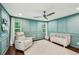 Stylish Bedroom features wainscoting, a ceiling fan, hardwood floors and natural light at 3851 Glenhurst Se Dr, Smyrna, GA 30080