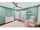 Spacious Bedroom with wainscoting detail, hardwood floors, and neutral tones, including a view to the vanity at 3851 Glenhurst Se Dr, Smyrna, GA 30080