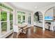 Breakfast nook with a round table and chairs, connected to a living room through arched doorways at 3851 Glenhurst Se Dr, Smyrna, GA 30080
