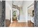 Spacious foyer with hardwood floors, a grand staircase, and abundant natural light at 3851 Glenhurst Se Dr, Smyrna, GA 30080
