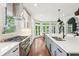 Bright kitchen featuring white cabinets, stainless steel appliances, and a center island at 3851 Glenhurst Se Dr, Smyrna, GA 30080