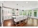 Modern kitchen featuring a large island, stainless steel appliances, and breakfast area at 3851 Glenhurst Se Dr, Smyrna, GA 30080