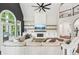 Bright living room featuring a fireplace, large windows, and comfortable seating at 3851 Glenhurst Se Dr, Smyrna, GA 30080