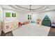 Bright playroom featuring neutral walls and carpet, multiple windows, and a fun assortment of toys for children at 3851 Glenhurst Se Dr, Smyrna, GA 30080