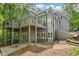 Rear exterior featuring a deck and a walkout basement, showcasing the home's outdoor living spaces at 3851 Glenhurst Se Dr, Smyrna, GA 30080