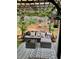 Outdoor seating area under a pergola, featuring stylish furniture and landscaping at 51 Norton Ave, Acworth, GA 30101