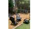 Backyard setting featuring a fire pit with chairs, perfect for outdoor entertaining at 51 Norton Ave, Acworth, GA 30101