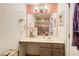 Bright bathroom featuring framed mirror, modern vanity, and colorful shower curtain at 51 Norton Ave, Acworth, GA 30101