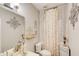 Cozy bathroom featuring decorative accents and a vanity with a well-lit mirror at 51 Norton Ave, Acworth, GA 30101