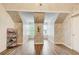 Bright bedroom with floral wallpaper, wood flooring, and unique architectural beams and design elements at 51 Norton Ave, Acworth, GA 30101