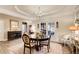 Elegant dining area features hardwood floors, a tray ceiling, and a stylish chandelier at 51 Norton Ave, Acworth, GA 30101