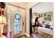 Warm and inviting entryway leading to a living area with piano and comfortable seating at 51 Norton Ave, Acworth, GA 30101