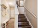 Well-lit entryway features hardwood floors leading to stairs, storage, and access to other parts of the home at 51 Norton Ave, Acworth, GA 30101