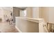 Bright hallway with hardwood floors and stairs leading to a doorway at 51 Norton Ave, Acworth, GA 30101