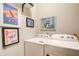 Laundry room featuring a washing machine and dryer with wall art at 51 Norton Ave, Acworth, GA 30101